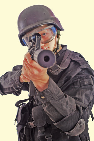Shot of a soldier holding gun. Uniform conforms to special services(soldiers) of the NATO...