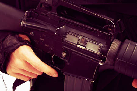 Shot of a soldier holding gun. Uniform conforms to special services(soldiers) of the NATO countries.
の写真素材