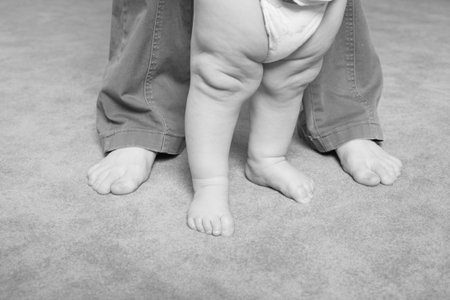 Beautiful babyand mother. Shot in a interior. 