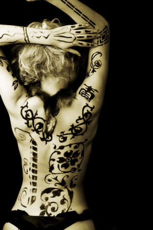 Art shot of a pretty model with bodypainting.  
