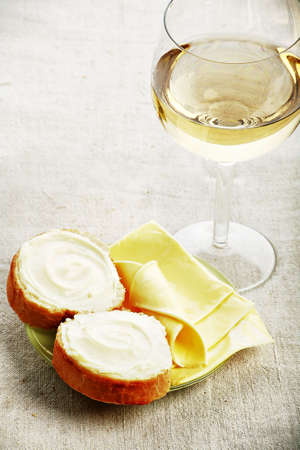 Dairy produce foodstuffs, wine. Shot in a studio. の写真素材