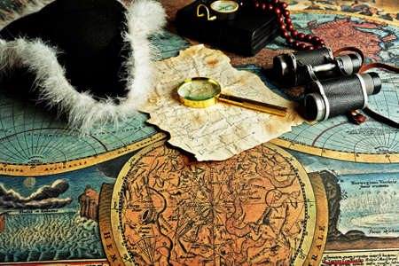 Old fashioned objects on the vintage mapの写真素材