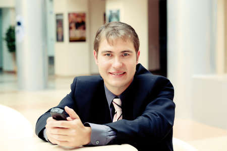 Business background: handsome businessman in a work process.の写真素材