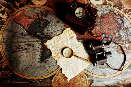 Old fashioned objects on the vintage mapの写真素材