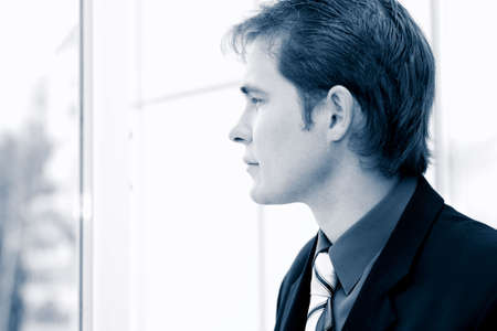 Business background: handsome businessman in a work process.の写真素材