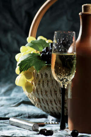 Wine composition: glass and bottle of wineの写真素材