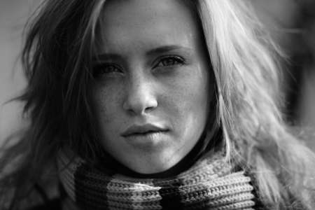 Young pretty woman in the autumn park.の写真素材