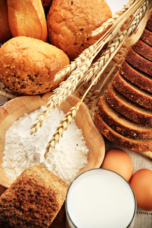 Baking ingredients, milk, and pastry isolated on white background