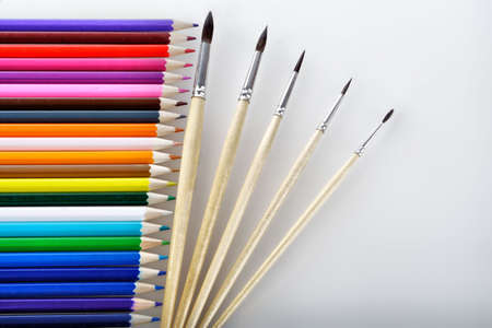 Writing materials: coloured pencils background.の写真素材