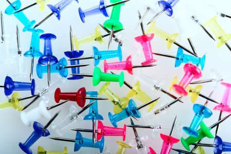 Writing materials: coloured thumbtack background.の写真素材