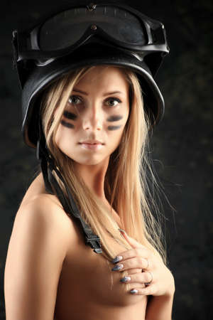 Shot of a beautiful girl holding gun.の写真素材