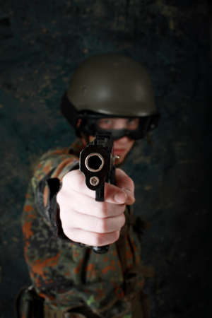Shot of a soldier holding gun.の写真素材