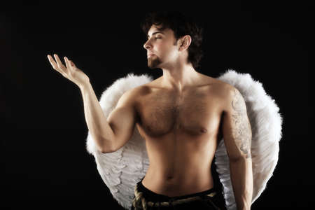 Handsome male angel. Shot in a studio.の写真素材