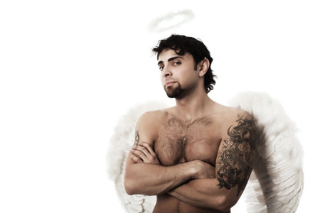 Handsome male angel. Shot in a studio.