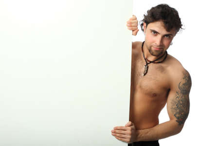 Handsome young man with a blank space for your advertisement.の写真素材