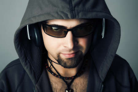 Handsome man in headphones enjoying the musicの写真素材