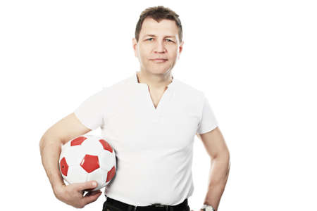 Portrait of a man holding a football. Shot in a studio. の写真素材