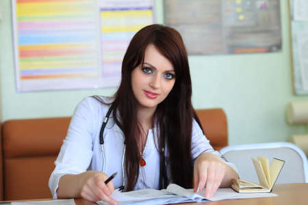 Medical theme: doctor is studying a medical report.の写真素材
