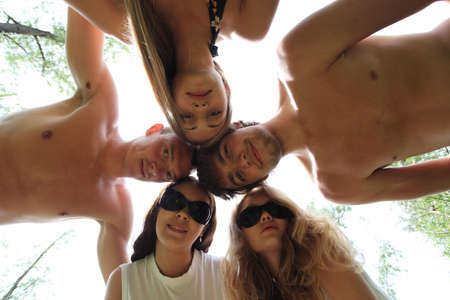 Cheerful young people having fun on a beach. Great summer holidays. の写真素材