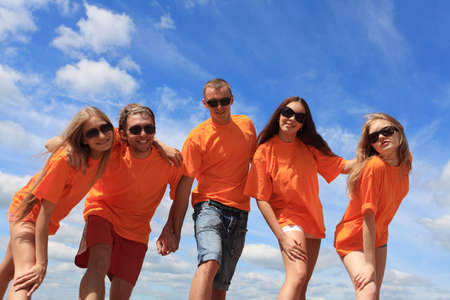 Cheerful young people having fun on a beach. Great summer holidays. の写真素材
