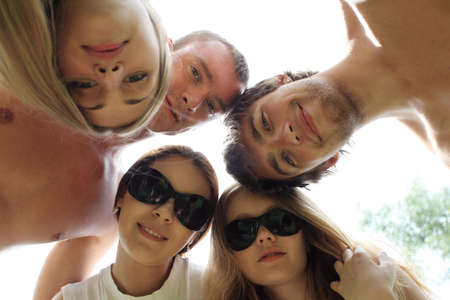Cheerful young people having fun on a beach. Great summer holidays. の写真素材