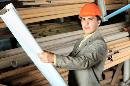 Industrial theme: a blue collar working at a manufacturing area.  
