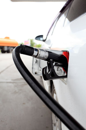 A process of fueling a car with petrol. 