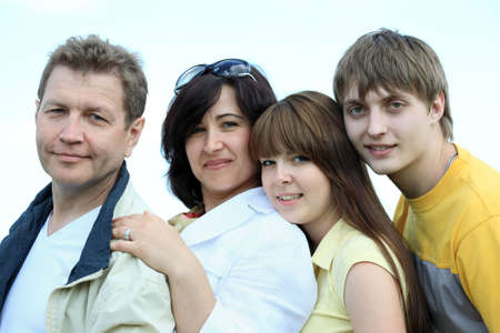 Happy family having a rest together outdoor.の写真素材