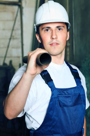 Industrial theme: a worker at a manufacturing area.  の写真素材