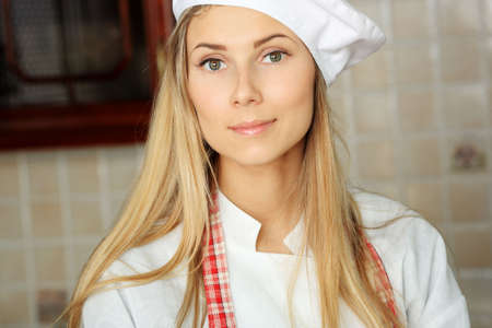 A cook is cooking on a kitchen.の写真素材