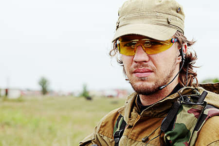 Shot of a soldier holding gun. Uniform conforms to special services.の写真素材