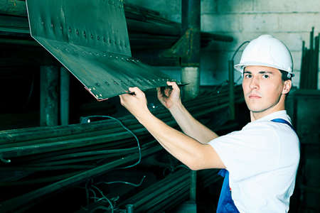 Industrial theme: a worker at a manufacturing area.  の写真素材
