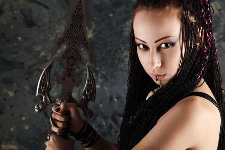 Beautiful female fighter with a sword in her hands.の写真素材