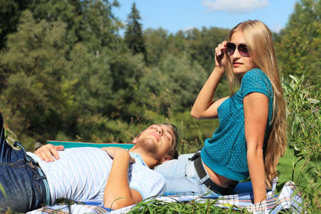 Portrait of a young couple in love at a picnic.の写真素材