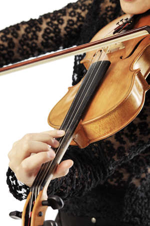 A young woman playing her violin with expression.の写真素材