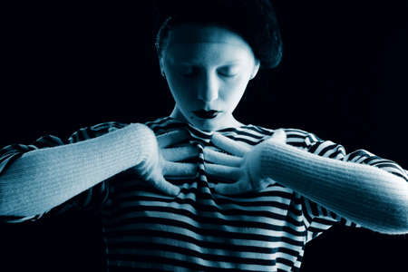 Portrait of a female mime in sailor's striped vest.の写真素材
