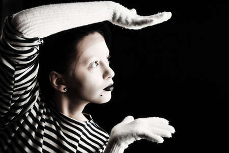 Portrait of a female mime in sailor's striped vest.の写真素材