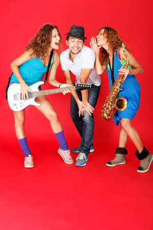 Shot of a musical band playing their instruments with great emotions.の写真素材