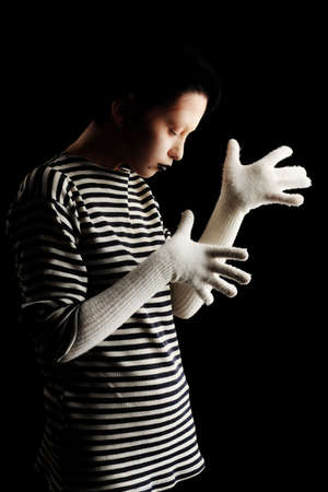 Portrait of a female mime in sailor's striped vest.の写真素材