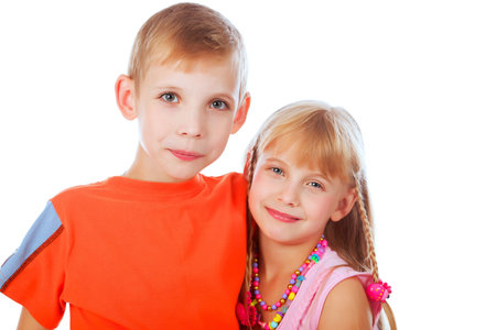 Portrait of couple of children, sister and brother. Shot in a studio. 