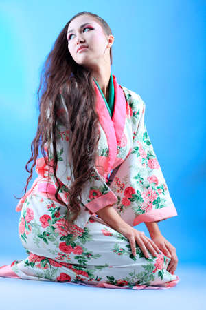 Portrait of a beautiful asian woman wearing kimono.の写真素材