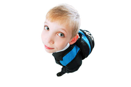 Portrait of a funny schoolboy with his bag.の写真素材