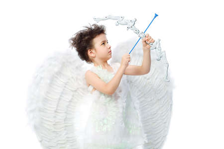 Beautiful little angel at a white background.の写真素材