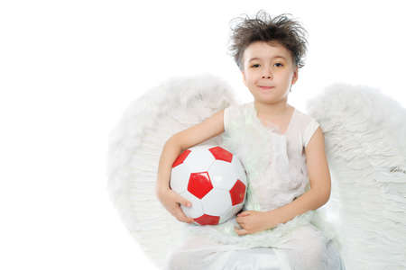 Beautiful little angel holding a ball. Isolated over white background.の写真素材