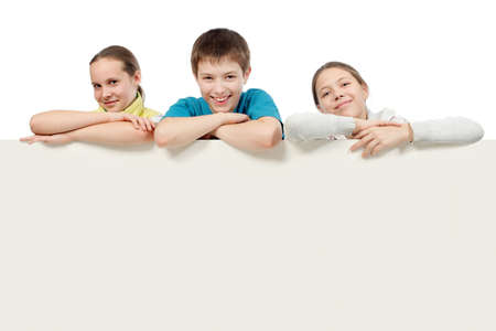 Group of teenagers looking out white board.の写真素材