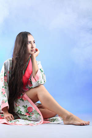 Portrait of a beautiful asian woman wearing kimono.の写真素材