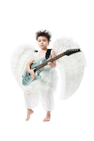 Beautiful little angel with a guitar at a white background.の写真素材