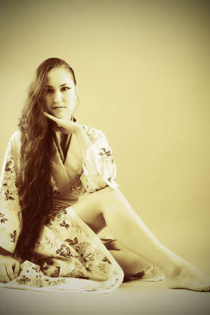 Portrait of a beautiful asian woman wearing kimono.の写真素材