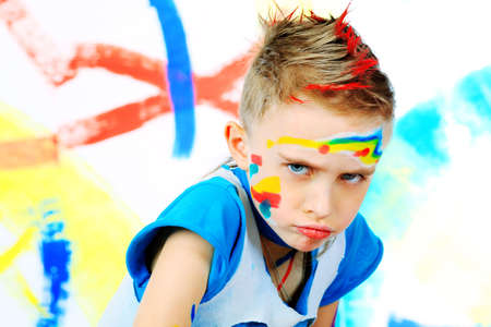 Portrait of a beautiful child enjoying his painting. Education.の写真素材