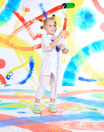 Portrait of a beautiful child enjoying her painting. Education.の写真素材